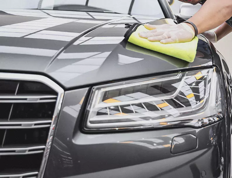 A German Expert Cleaning the Car Bonnet