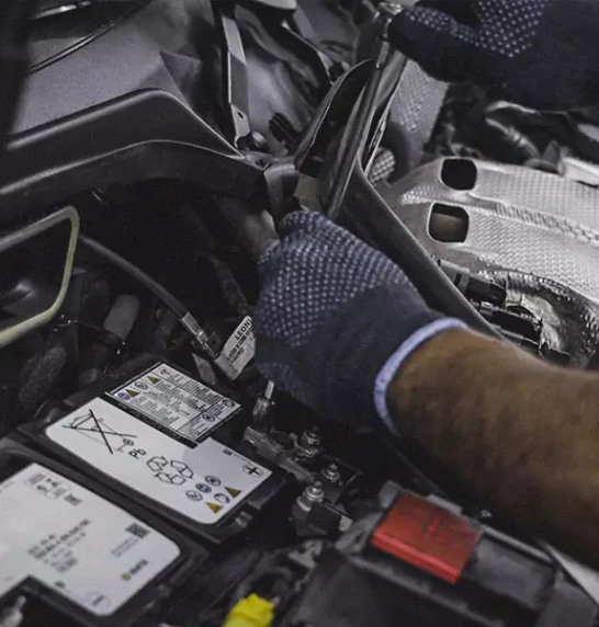 A Worker Fixing the Car Engine Control Unit