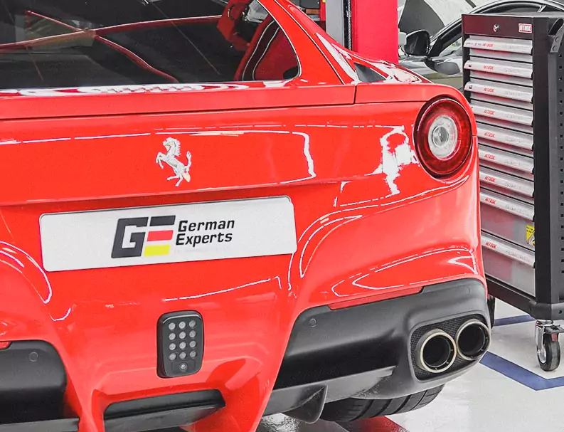 Red Ferrari Having German Experts Number Plate on Back